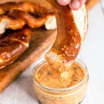 Aztec Sauce - southwest sauce clone in glass jar and pretzel dipping into it