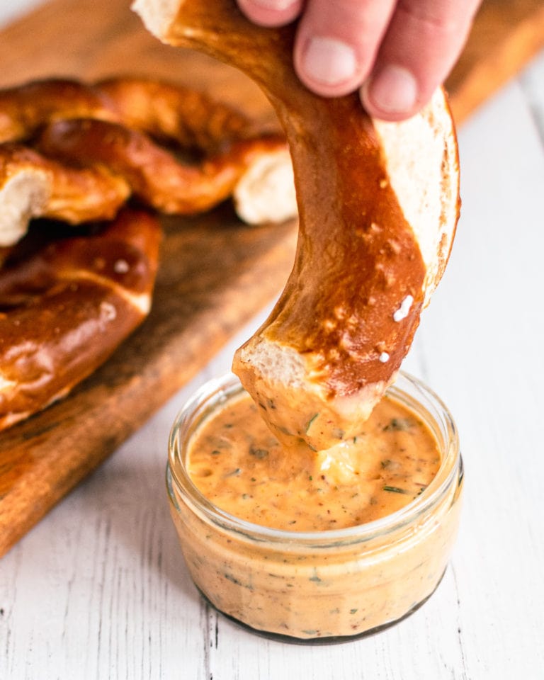 Aztec Sauce - southwest sauce clone in glass jar and pretzel dipping into it