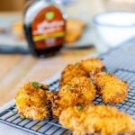 Super easy chicken strips that are healthy for kids and quick to make. This ridiculously tasty baked chicken strips recipe is worth switching from store bought. #chicken #familyfood #ovenfried #chickenstrips
