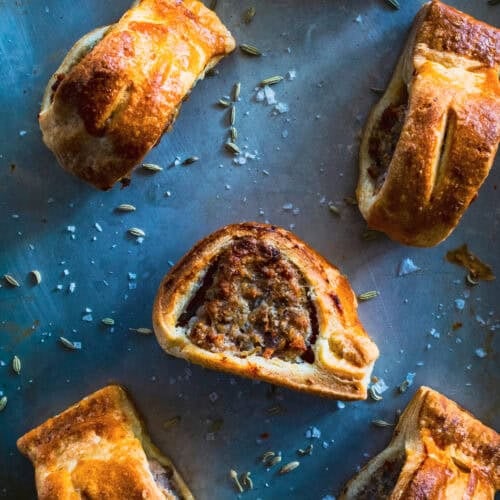 English Sausage Rolls with Fennel and Herbs on a pan