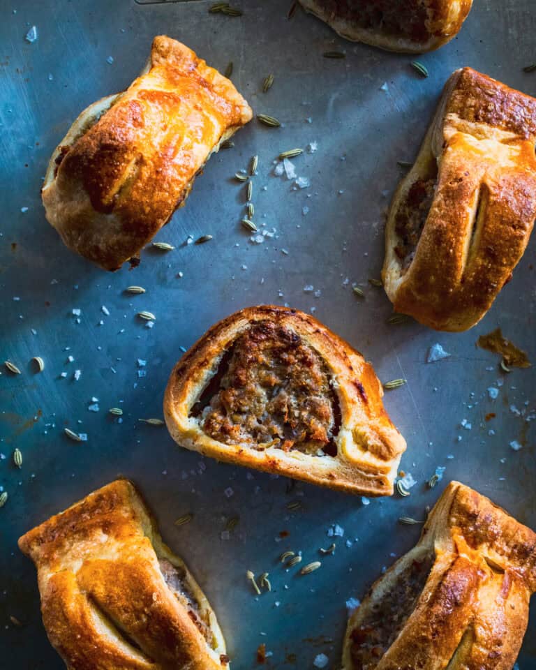 English Sausage Rolls with Fennel and Herbs on a pan