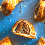 English sausage rolls overhead shot on baking sheet
