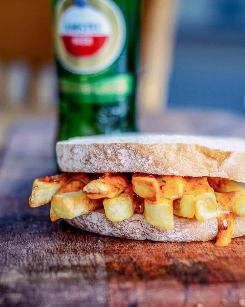 A traditional British chip butty filled with hot chips and spicy harissa mayo.