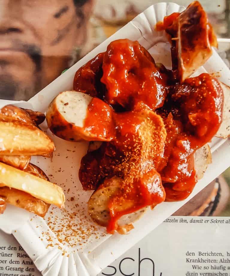 currywurst with fries in a tray