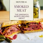 Montreal smoked meat piled high on rye bread with yellow mustard and dill pickles