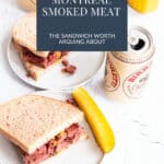 Montreal smoked meat piled high on rye bread with yellow mustard and dill pickles