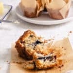 Split wild blueberry muffin showing tender crumb and bursting blueberries